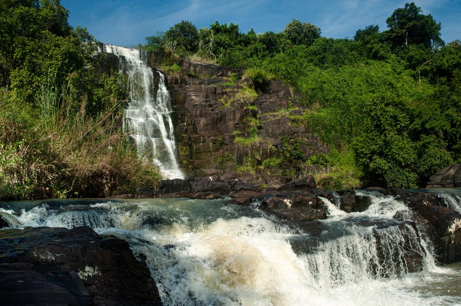 Aruu Falls cascading through green vegetation in Northern Uganda