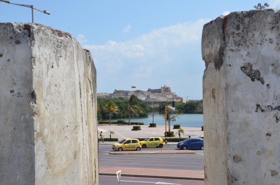 Stone walls of Cartagena’s historic city center with San Felipe de Barajas in the background.