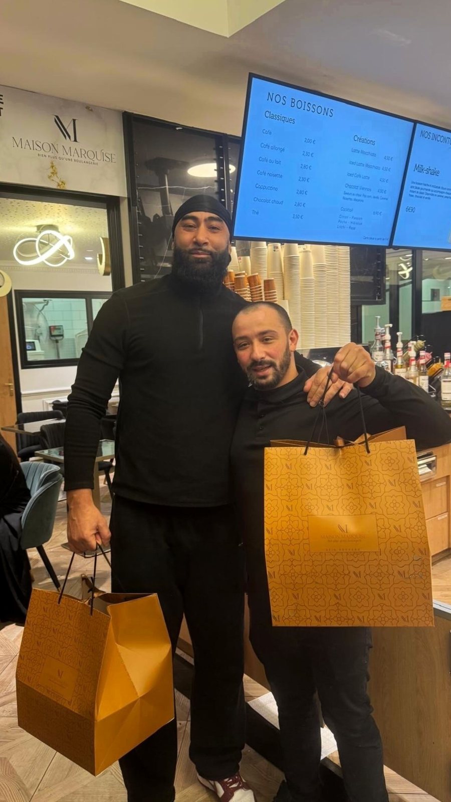 File:La Fouine and Akim Bouhadda at Maison Marquise bakery in Chevilly-Larue, France, 2026-02-25.jpg